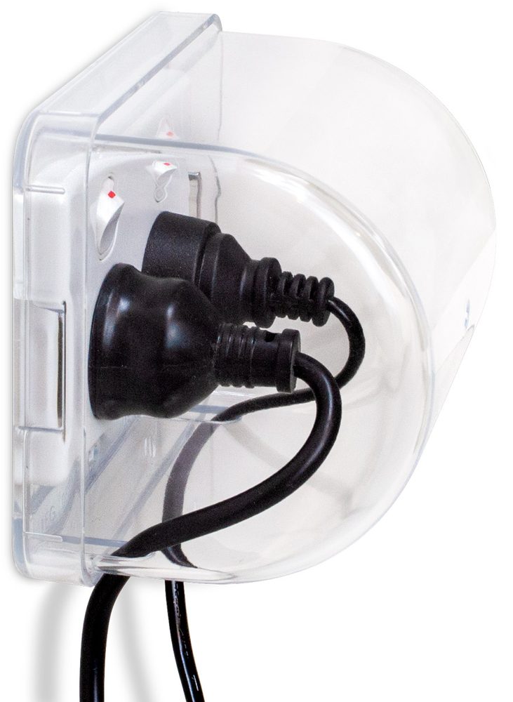 Side view of the Micky Ha Ha cover showing its rounded dome profile with two plugs inside and cords exiting the bottom